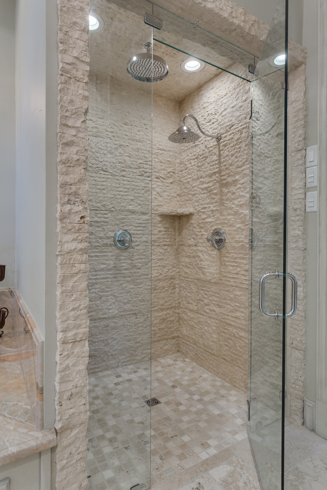 Example of a large classic master beige tile and stone tile marble floor and beige floor alcove shower design in Dallas with furniture-like cabinets, beige cabinets, an undermount tub, a two-piece toilet, white walls, an undermount sink, granite countertops and a hinged shower door