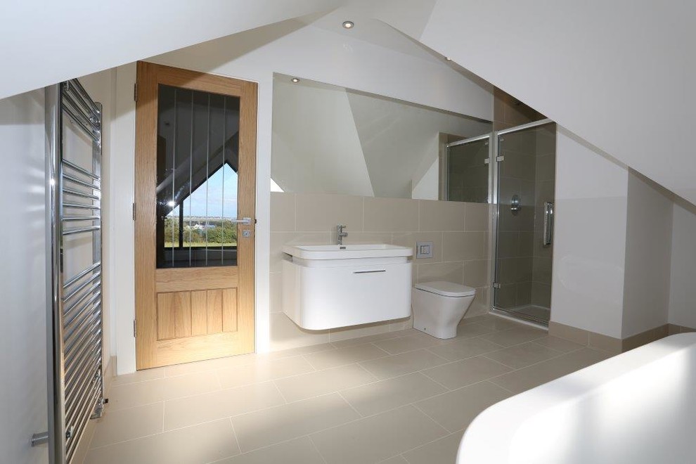 Inspiration for a medium sized contemporary bathroom in Essex with flat-panel cabinets, white cabinets, a freestanding bath, a wall mounted toilet, beige tiles, porcelain tiles, white walls, porcelain flooring, a wall-mounted sink, laminate worktops, beige floors, a hinged door and white worktops.