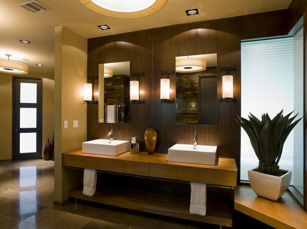 Photo of a contemporary bathroom in Austin with wooden worktops and feature lighting.