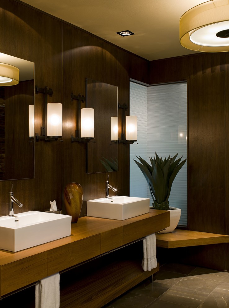 Design ideas for a contemporary bathroom in Austin with a vessel sink and feature lighting.