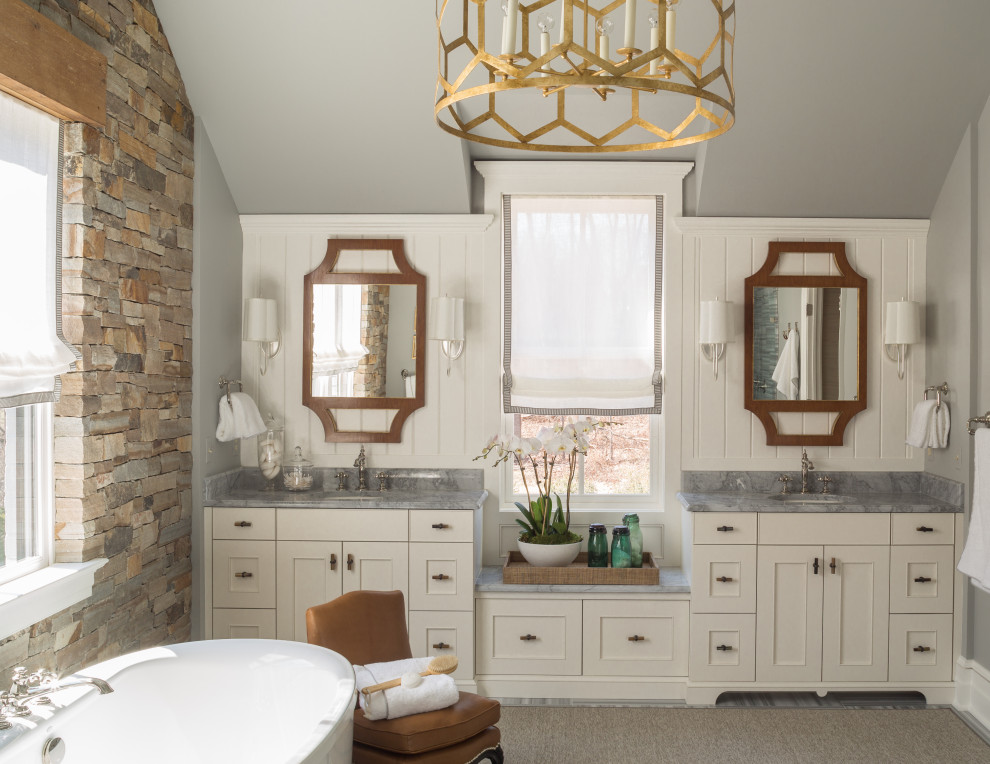 Transitional gray floor, double-sink and vaulted ceiling freestanding bathtub photo in DC Metro with recessed-panel cabinets, white cabinets, gray walls, an undermount sink, gray countertops and a built-in vanity