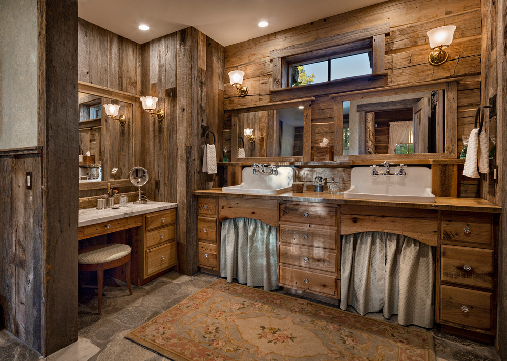 Rustic ensuite bathroom in Other with flat-panel cabinets, dark wood cabinets, grey walls, a built-in sink and wooden worktops.