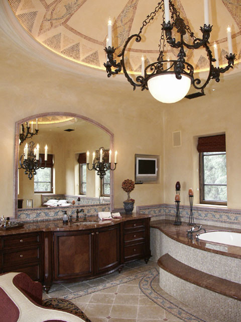 Идея дизайна: огромная главная ванная комната в средиземноморском стиле с фасадами островного типа, темными деревянными фасадами, полновстраиваемой ванной, каменной плиткой, мраморным полом, врезной раковиной и мраморной столешницей
