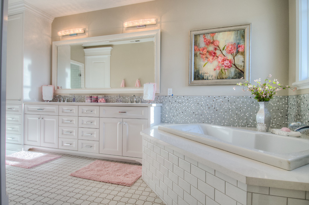 Large traditional family bathroom in Salt Lake City with a submerged sink, recessed-panel cabinets, white cabinets, engineered stone worktops, a built-in bath, an alcove shower, a one-piece toilet, white tiles, ceramic tiles, grey walls and ceramic flooring.