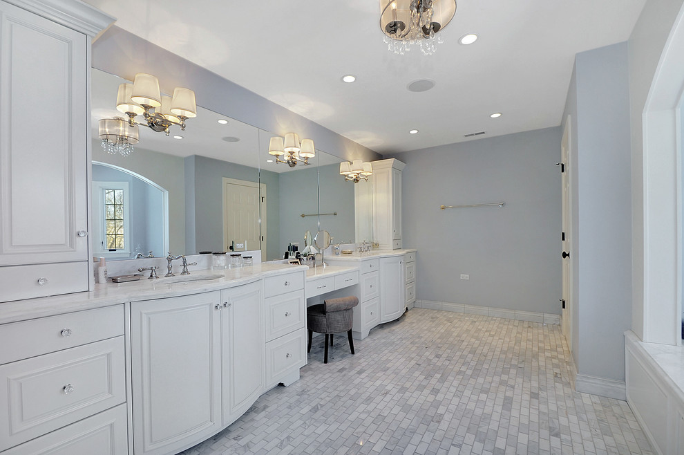 Large elegant master stone tile and gray tile porcelain tile bathroom photo in Chicago with raised-panel cabinets, white cabinets, marble countertops, gray walls and an undermount sink