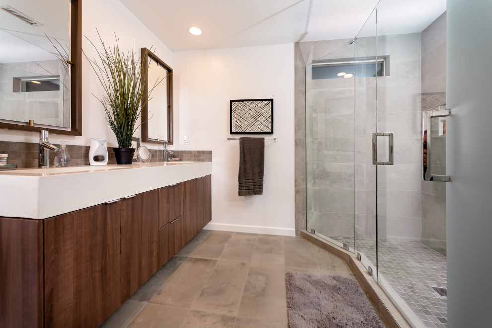 Example of a mid-sized trendy master white tile porcelain tile, gray floor and double-sink bathroom design in San Diego with flat-panel cabinets, brown cabinets, a one-piece toilet, white walls, an undermount sink, quartz countertops, white countertops and a floating vanity