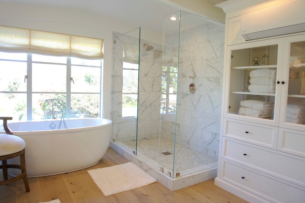 Example of a mid-sized cottage master white tile and stone tile terra-cotta tile bathroom design in San Diego with furniture-like cabinets, white cabinets, white walls, an undermount sink and marble countertops