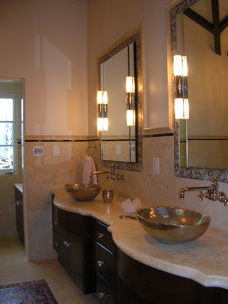 Example of a mid-sized classic beige tile and ceramic tile travertine floor and beige floor bathroom design in San Diego with beaded inset cabinets, dark wood cabinets, a one-piece toilet, beige walls, a vessel sink and marble countertops