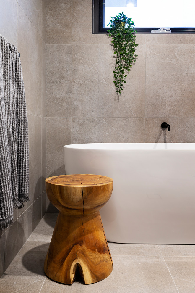 Mid-sized minimalist master gray tile porcelain tile bathroom photo in Canberra - Queanbeyan with medium tone wood cabinets, gray walls, a vessel sink, quartz countertops, a hinged shower door and white countertops