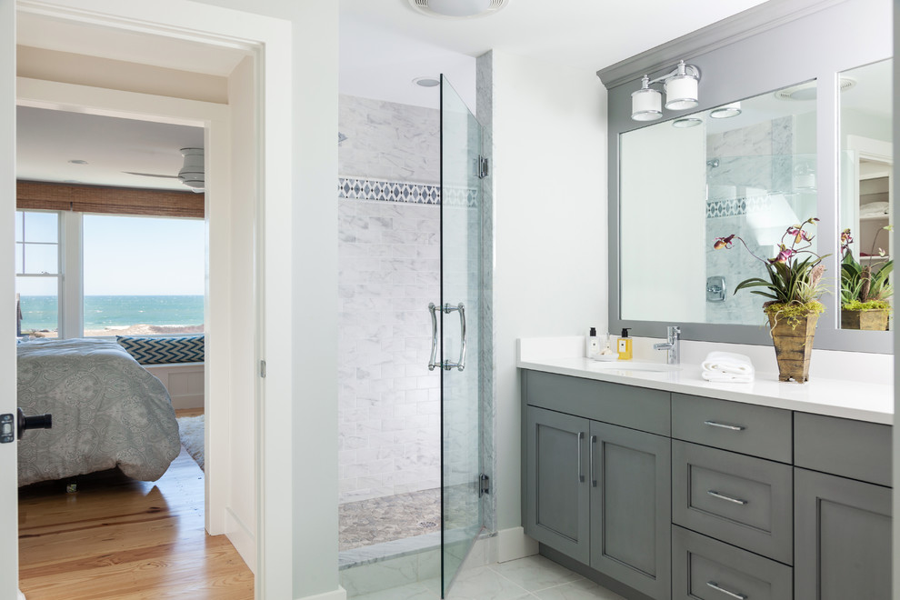 Inspiration for a mid-sized coastal master marble tile marble floor double shower remodel in Boston with beaded inset cabinets, white cabinets, white walls, an undermount sink and quartz countertops