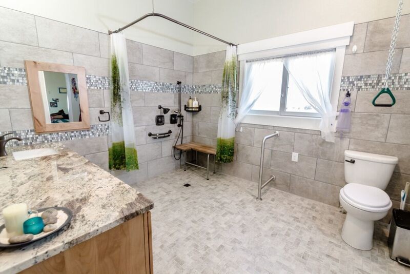 Photo of a medium sized classic family bathroom in Denver with shaker cabinets, medium wood cabinets, a walk-in shower, a one-piece toilet, grey tiles, ceramic tiles, purple walls, ceramic flooring, a submerged sink, granite worktops, grey floors and a shower curtain.