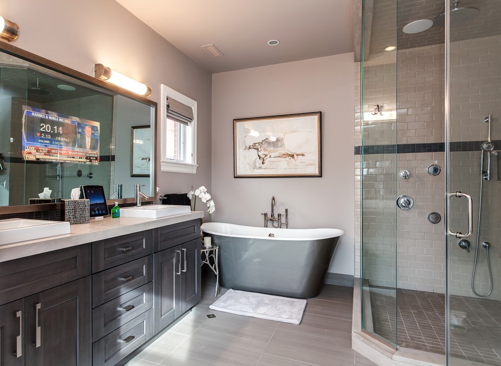 Photo of a medium sized classic ensuite bathroom in Denver with shaker cabinets, grey cabinets, engineered stone worktops, a freestanding bath, a corner shower, a one-piece toilet, grey tiles, ceramic tiles, grey walls, porcelain flooring and a built-in sink.