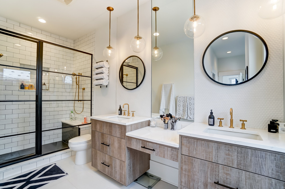 Classic bathroom in Columbus with flat-panel cabinets, light wood cabinets, an alcove shower, white tiles, white walls, a submerged sink, white floors, white worktops, double sinks and a built in vanity unit.