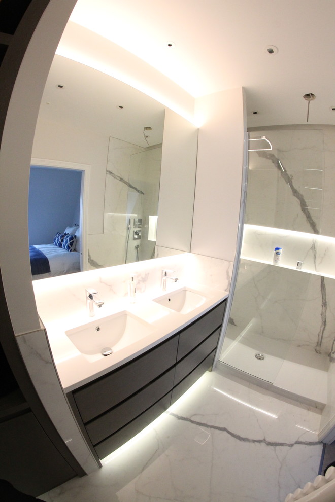 Example of a small trendy kids' white tile marble floor drop-in bathtub design in London with open cabinets, white cabinets, white walls and marble countertops
