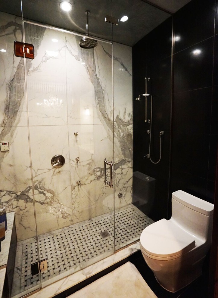 Medium sized contemporary shower room bathroom in Bridgeport with a corner shower, a one-piece toilet, beige tiles, grey tiles, white tiles, stone slabs, black walls and porcelain flooring.
