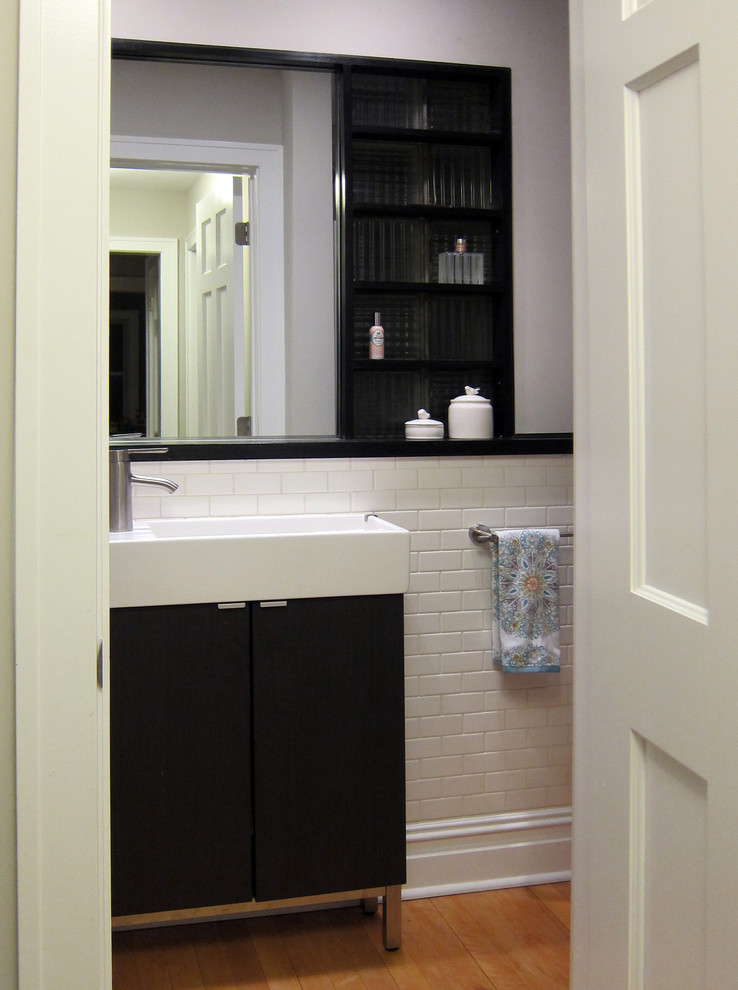 Elegant bathroom photo in Chicago with dark wood cabinets