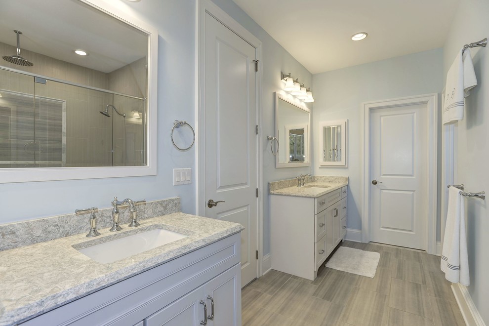 Design ideas for a nautical bathroom in Baltimore with recessed-panel cabinets, light wood cabinets, blue walls, a submerged sink, granite worktops, grey floors and grey worktops.