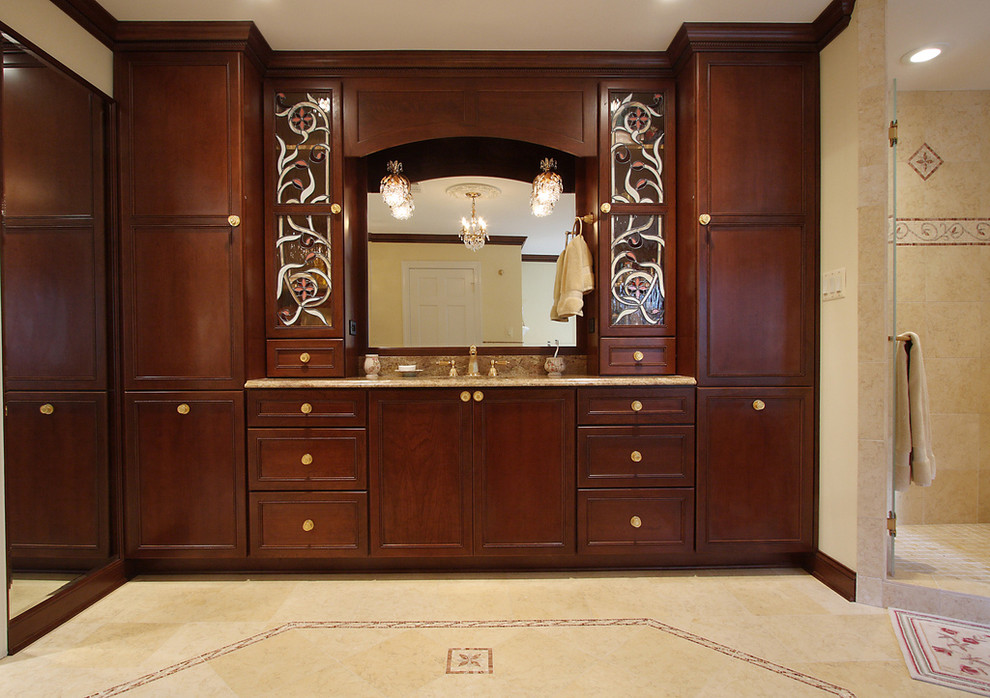 Traditional bathroom in DC Metro with recessed-panel cabinets, dark wood cabinets and beige tiles.