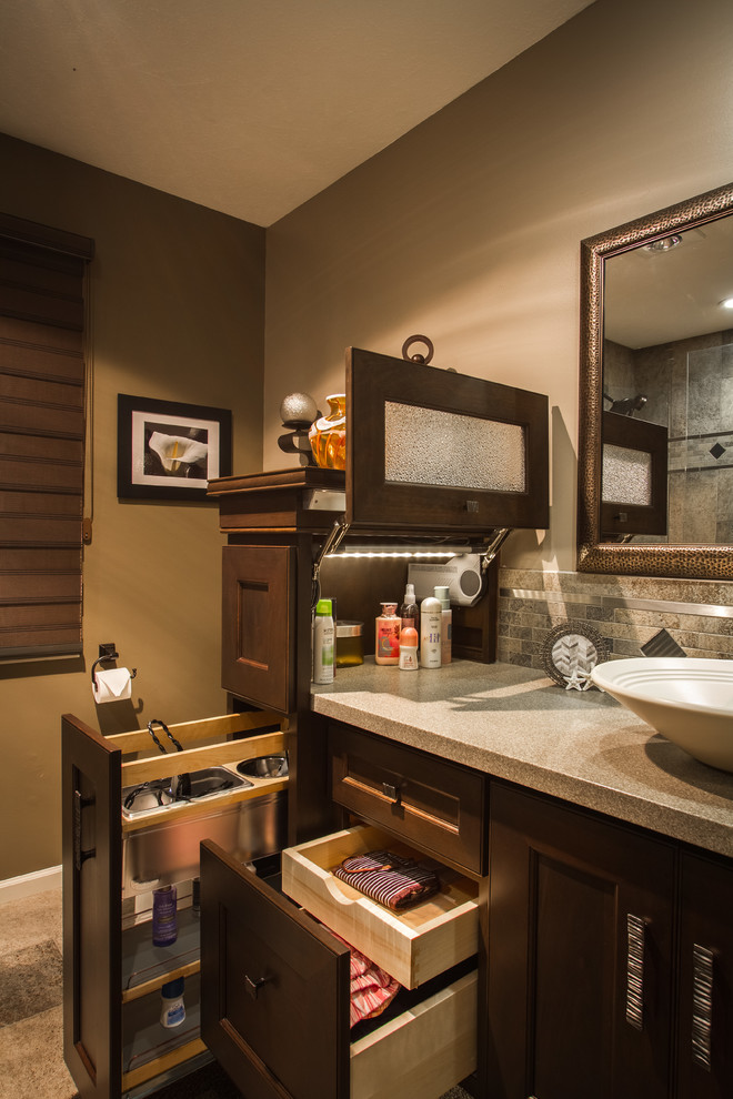 Transitional bathroom photo in Omaha with a vessel sink, recessed-panel cabinets, dark wood cabinets and brown walls