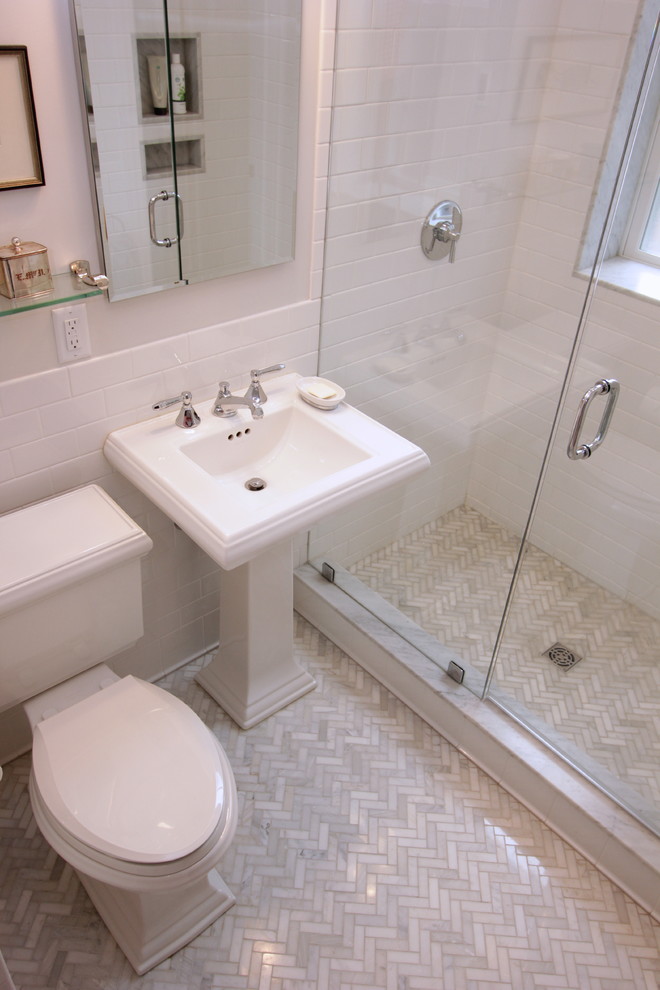 Design ideas for a bathroom in Boston with a pedestal sink, an alcove shower, a two-piece toilet, white tiles, ceramic tiles and marble flooring.