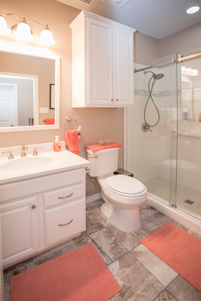 Small elegant kids' white tile and porcelain tile porcelain tile and gray floor bathroom photo in Dallas with raised-panel cabinets, white cabinets, a two-piece toilet, beige walls, an undermount sink and quartz countertops