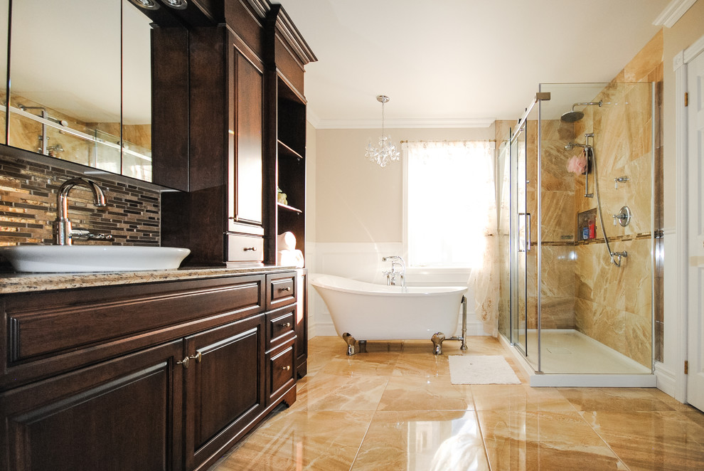 This is an example of a medium sized classic ensuite bathroom in Montreal with raised-panel cabinets, dark wood cabinets, quartz worktops, a freestanding bath, a corner shower, beige tiles, porcelain tiles, beige walls and ceramic flooring.