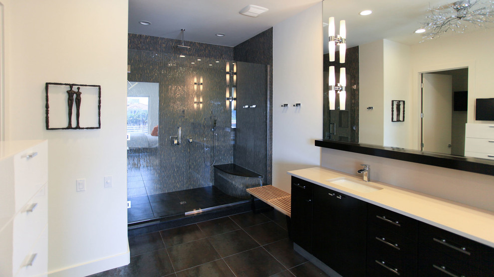 Example of a large minimalist master black tile and ceramic tile ceramic tile alcove shower design in Dallas with an undermount sink, flat-panel cabinets, dark wood cabinets, granite countertops, a one-piece toilet and beige walls