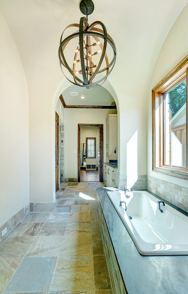 Large mountain style master stone tile slate floor bathroom photo in Dallas with shaker cabinets, beige cabinets, beige walls and an undermount sink