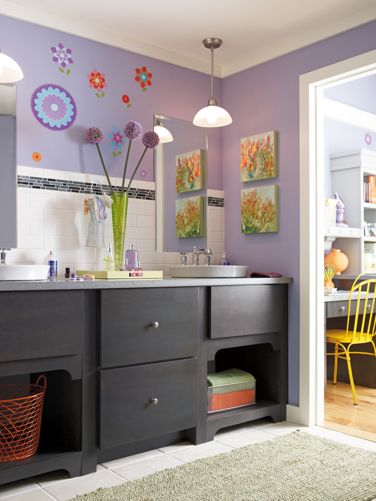 Bathroom - mid-sized eclectic kids' subway tile ceramic tile bathroom idea in Indianapolis with a vessel sink, flat-panel cabinets, black cabinets, purple walls and limestone countertops