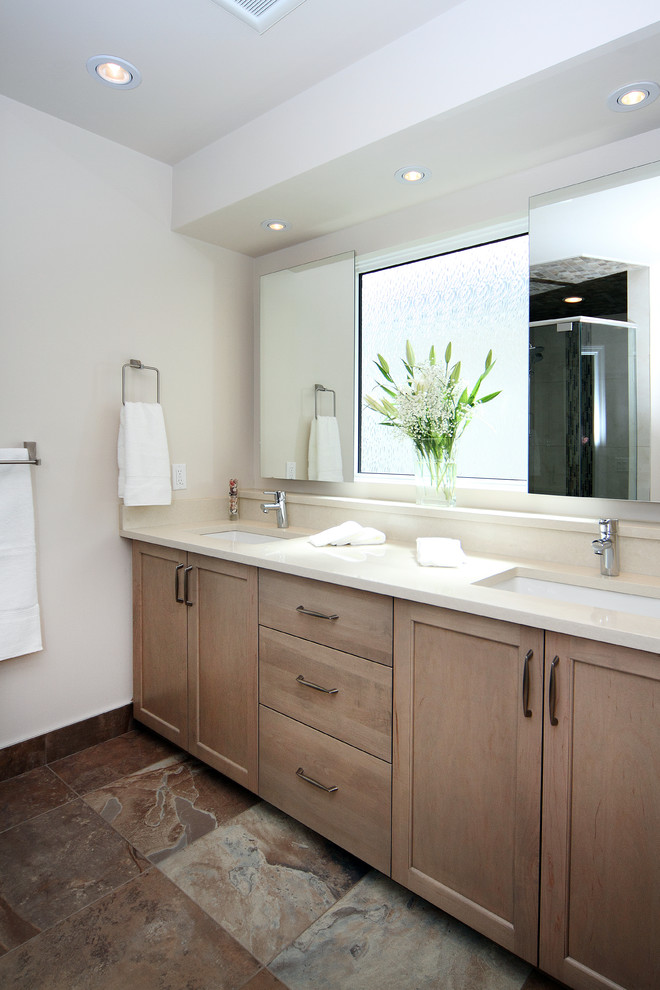 Photo of a medium sized traditional ensuite bathroom in Calgary with shaker cabinets, beige cabinets, white tiles, white walls, porcelain flooring, a submerged sink, quartz worktops and brown floors.