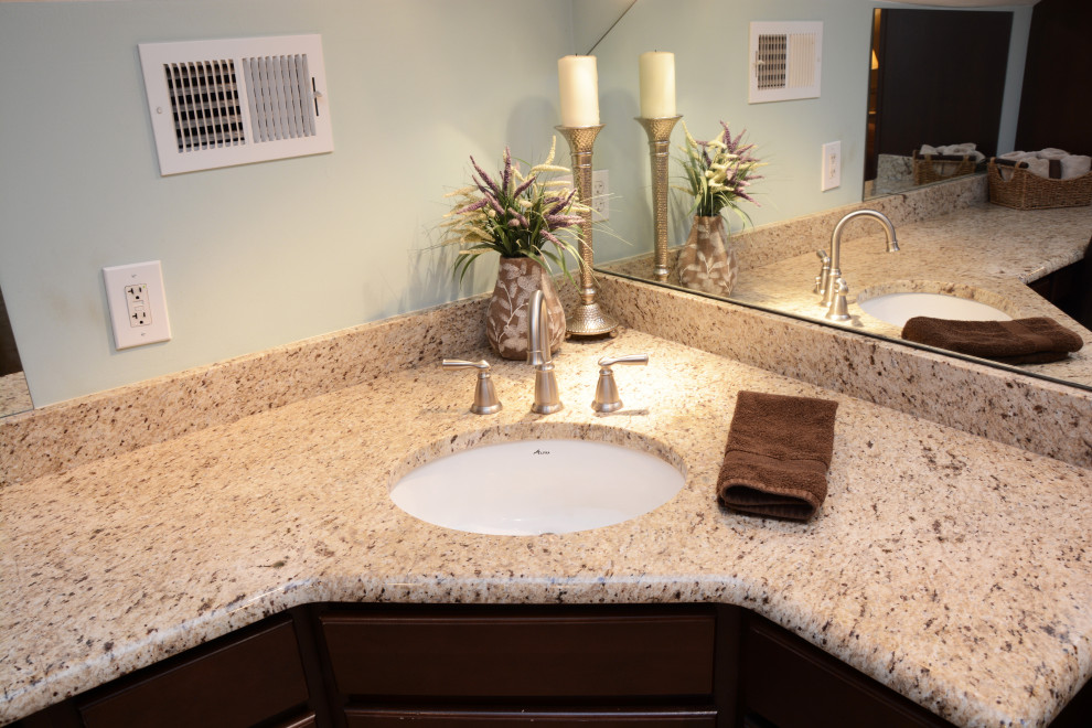 Example of a mid-sized classic master single-sink bathroom design in DC Metro with raised-panel cabinets, dark wood cabinets, granite countertops, beige countertops and a freestanding vanity