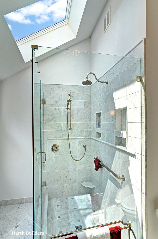 Photo of a medium sized classic ensuite bathroom in Philadelphia with flat-panel cabinets, white cabinets, a two-piece toilet, grey tiles, stone tiles, grey walls, marble flooring, a wall-mounted sink and marble worktops.