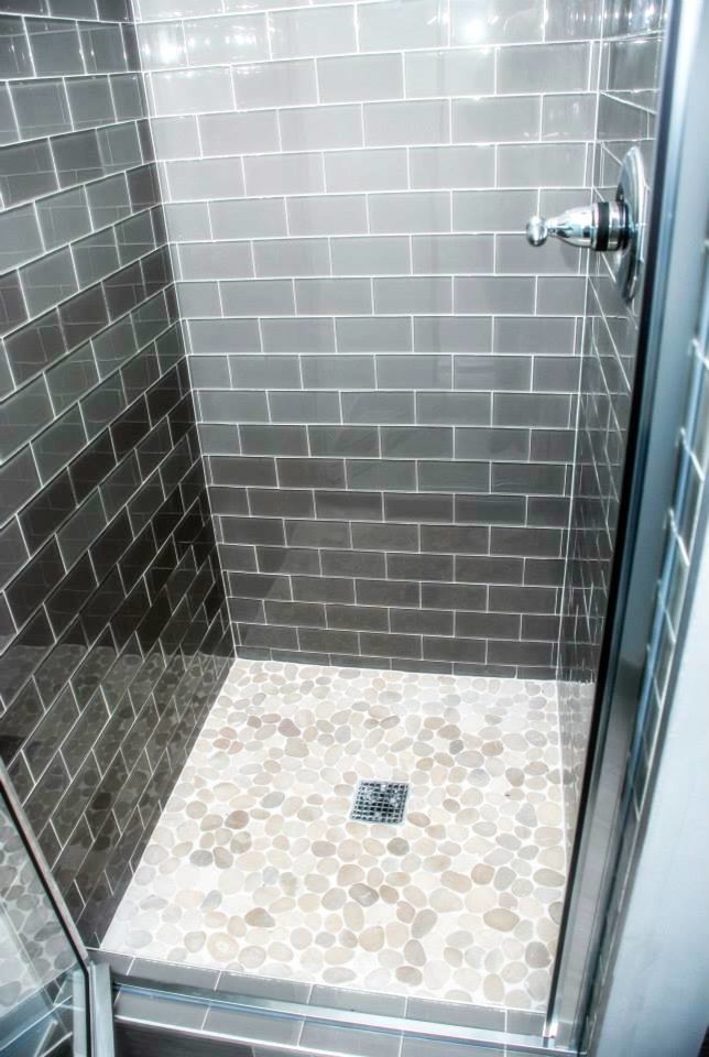 This is an example of a large classic shower room bathroom in Denver with an integrated sink, recessed-panel cabinets, dark wood cabinets, marble worktops, a corner shower, a one-piece toilet, grey tiles, glass tiles, grey walls and porcelain flooring.