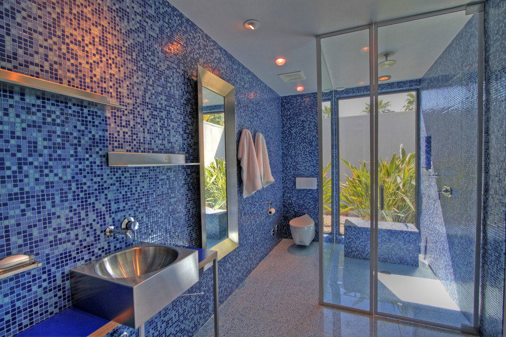 Modern bathroom in Orange County with mosaic tiles and a wall mounted toilet.