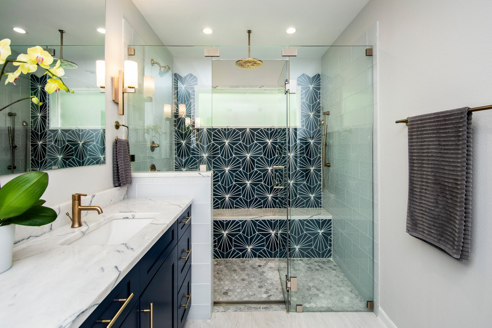 Inspiration for a large transitional master gray tile and cement tile porcelain tile and beige floor double shower remodel in Dallas with flat-panel cabinets, blue cabinets, a two-piece toilet, gray walls, an undermount sink, marble countertops, a hinged shower door and white countertops