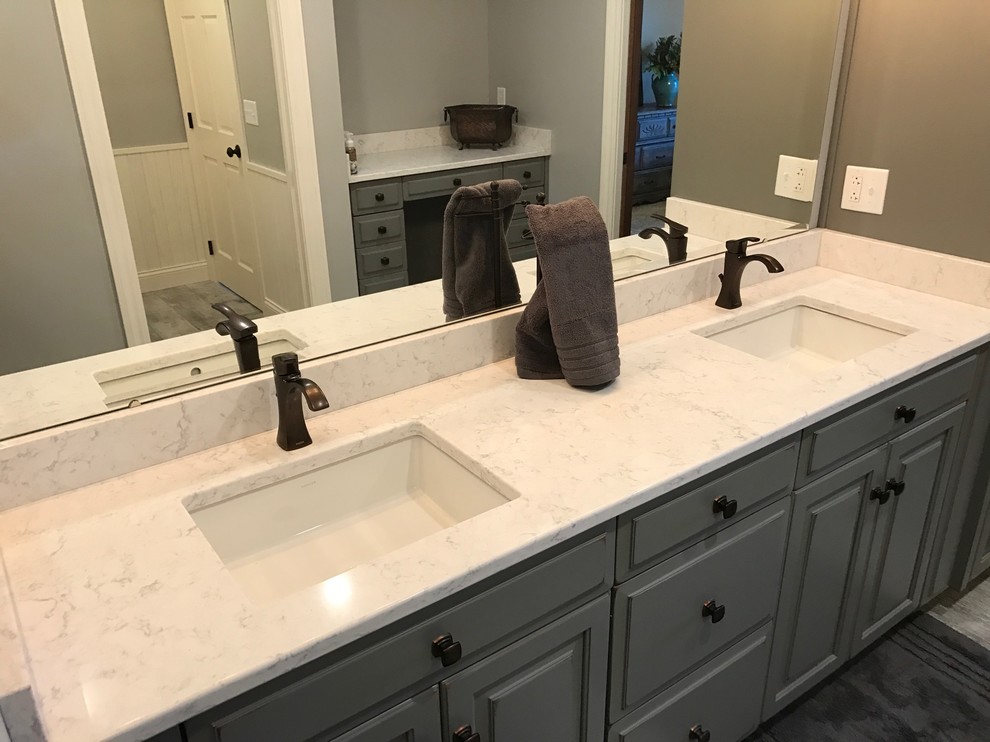 Medium sized traditional ensuite bathroom in Other with raised-panel cabinets, grey cabinets, grey tiles, grey walls, porcelain flooring, a submerged sink, engineered stone worktops and grey floors.