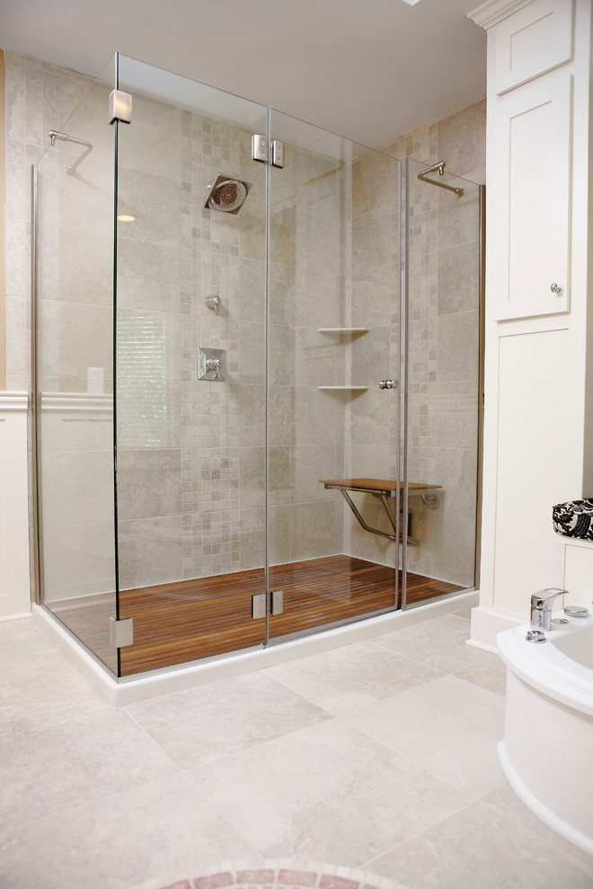 Large classic ensuite bathroom in Minneapolis with a submerged sink, freestanding cabinets, black cabinets, quartz worktops, a freestanding bath, a walk-in shower, a one-piece toilet, beige tiles, porcelain tiles, beige walls and porcelain flooring.
