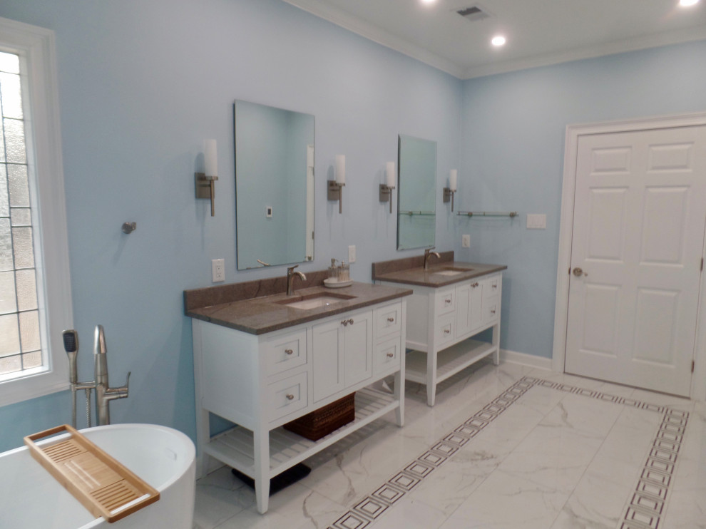 Example of a large transitional master white tile and porcelain tile porcelain tile, white floor and single-sink bathroom design in Other with furniture-like cabinets, white cabinets, a one-piece toilet, blue walls, an undermount sink, quartz countertops, gray countertops and a freestanding vanity