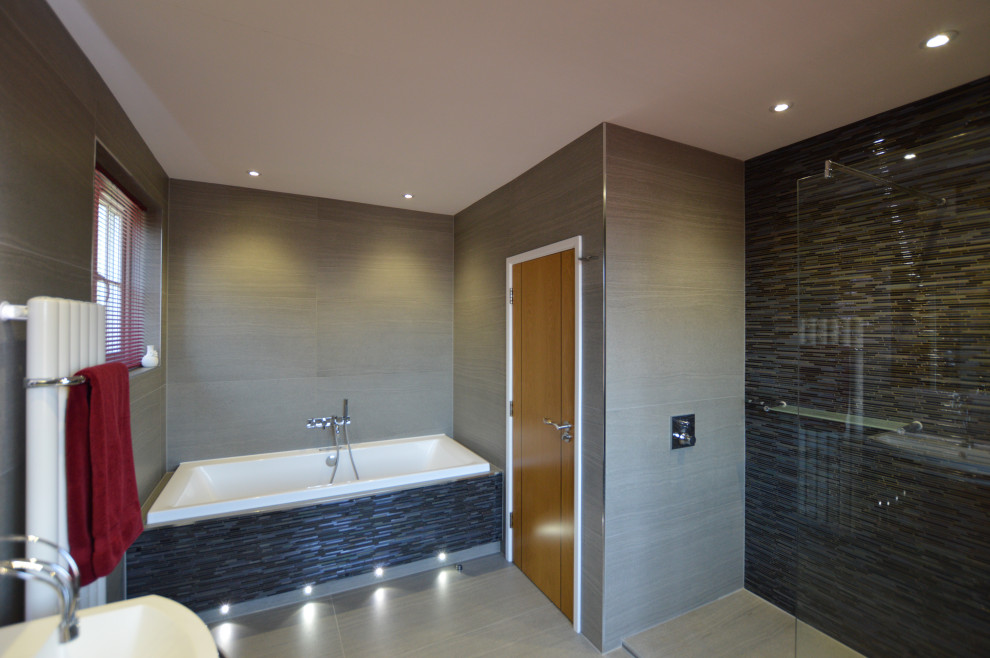 This is an example of a small modern family bathroom in London with flat-panel cabinets.