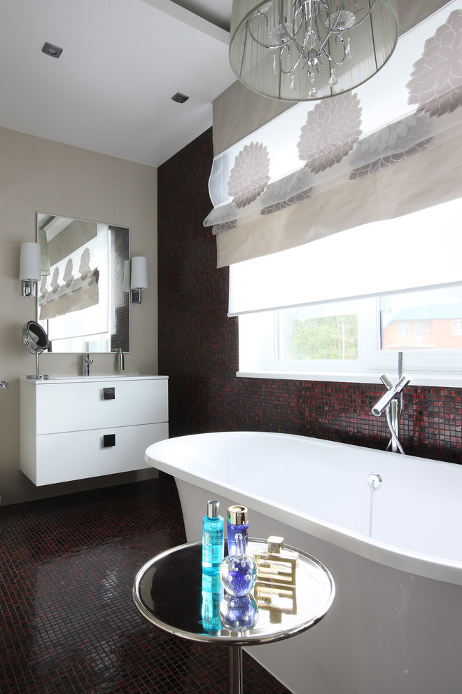 This is an example of a contemporary ensuite bathroom in Moscow with flat-panel cabinets, white cabinets, a freestanding bath, red tiles, mosaic tiles, mosaic tile flooring and a built-in sink.