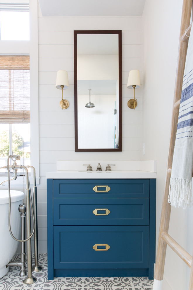 Inspiration for a mid-sized country master multicolored floor bathroom remodel in San Francisco with blue cabinets, white walls, white countertops and shaker cabinets