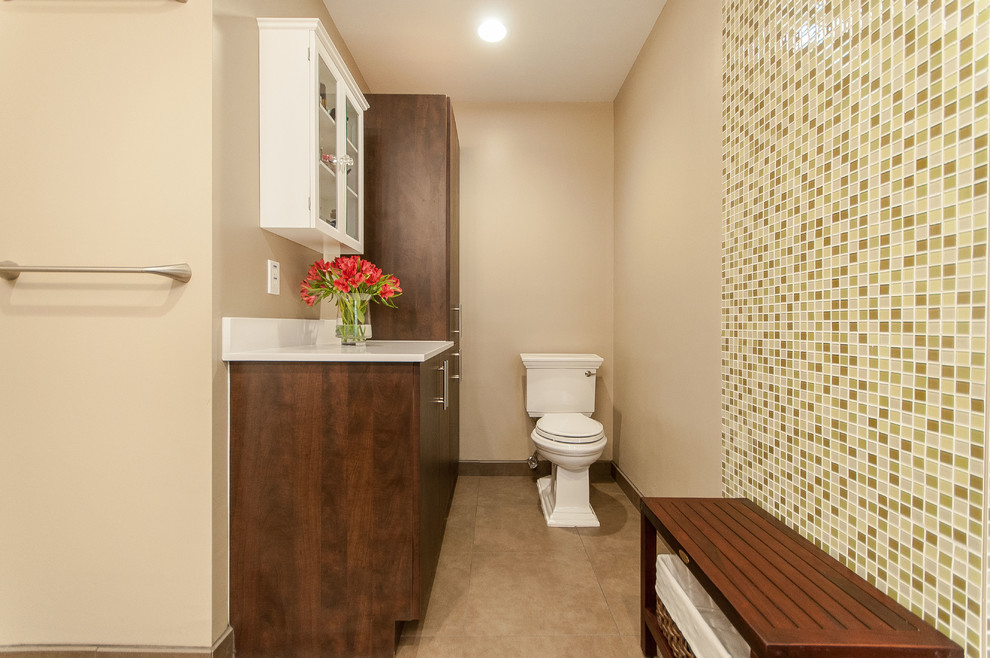 Bathroom - transitional beige tile and porcelain tile bathroom idea in Miami with flat-panel cabinets, brown cabinets, quartz countertops and a two-piece toilet