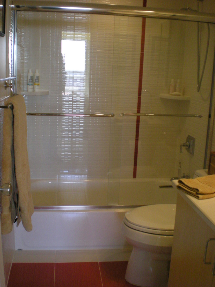 Photo of a small contemporary shower room bathroom in Philadelphia with a submerged sink, flat-panel cabinets, white cabinets, engineered stone worktops, an alcove bath, an alcove shower, a one-piece toilet, white tiles, ceramic tiles, white walls and porcelain flooring.