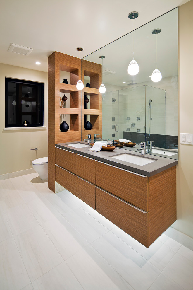 Inspiration for a mid-sized modern master porcelain tile porcelain tile bathroom remodel in San Francisco with an undermount sink, flat-panel cabinets, medium tone wood cabinets, quartz countertops and a two-piece toilet