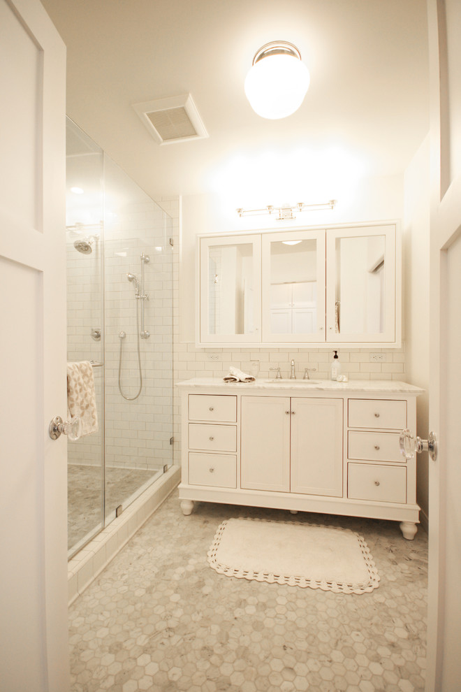 Inspiration for a romantic ensuite bathroom in Los Angeles with recessed-panel cabinets, white cabinets, an alcove shower, white tiles, white walls, marble flooring, a submerged sink and marble worktops.