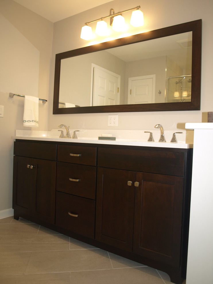 This is an example of a medium sized midcentury ensuite bathroom in Newark with beaded cabinets, dark wood cabinets, a built-in bath, an alcove shower, a two-piece toilet, ceramic flooring, a sliding door, white worktops and a submerged sink.