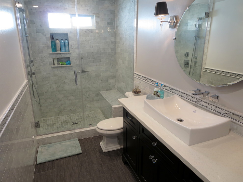 Example of a mid-sized minimalist 3/4 gray tile and subway tile alcove shower design in Los Angeles with a vessel sink, shaker cabinets, dark wood cabinets, a two-piece toilet and white walls
