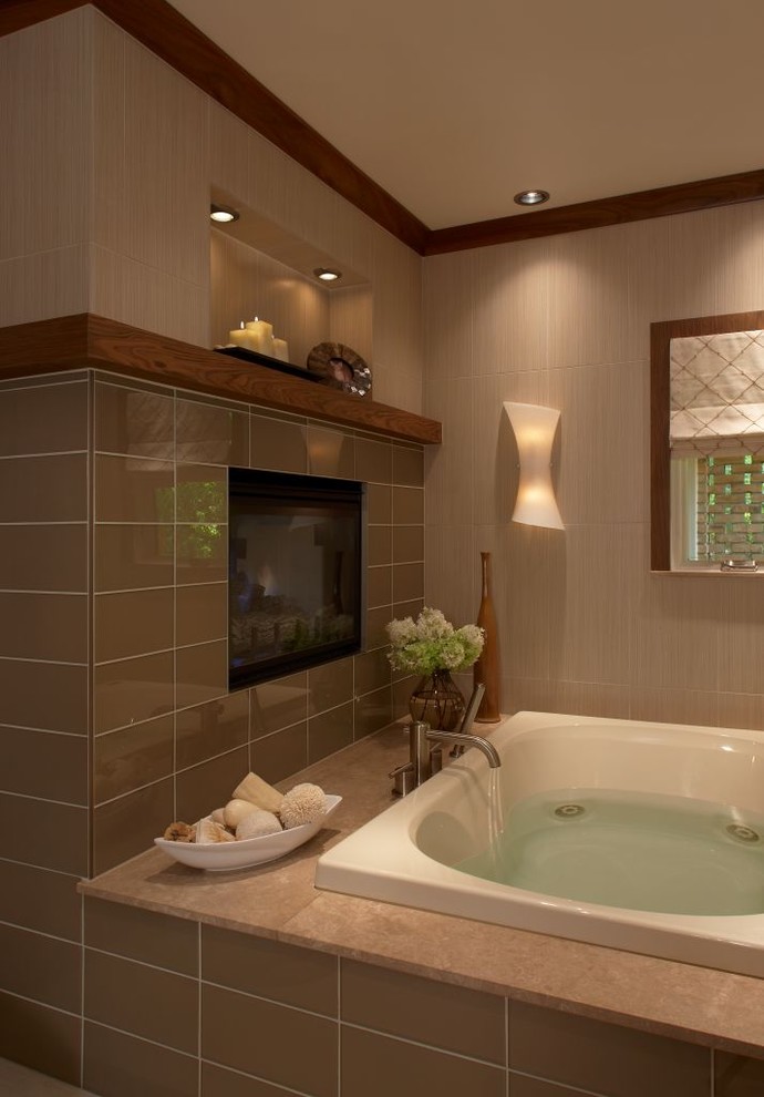 Design ideas for a contemporary bathroom in Detroit with a built-in bath, brown tiles and a chimney breast.