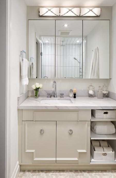 Design ideas for a small classic ensuite bathroom in Toronto with raised-panel cabinets, white cabinets, an alcove shower, a one-piece toilet, white tiles, metro tiles, white walls, travertine flooring, a submerged sink, marble worktops, beige floors and a hinged door.