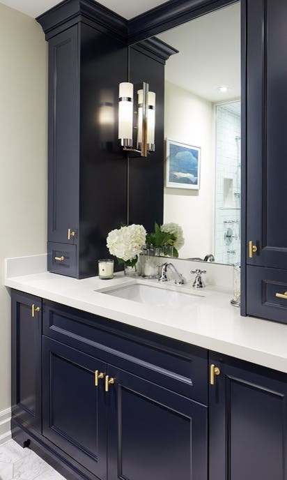 Small traditional family bathroom in Toronto with beaded cabinets, blue cabinets, an alcove shower, a one-piece toilet, white tiles, porcelain tiles, beige walls, porcelain flooring, a submerged sink, engineered stone worktops, white floors and a hinged door.